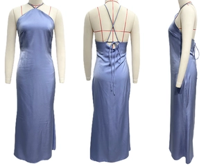 Detail of light blue satin backless dress showing halter neckline and cross-back straps