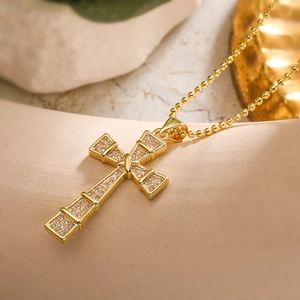 18K gold plated cross pendant necklace with sparkling cubic zirconia on a gold bead chain