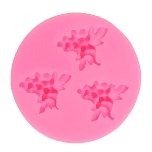 Pink round silicone mold featuring detailed floral leaf patterns for DIY cake fondant
