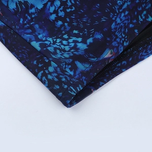 Detailed macro view of the blue abstract mesh fabric with precise double-needle stitching