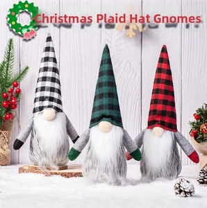 Three Christmas gnomes with plaid hats standing on a snow surface for festive decoration