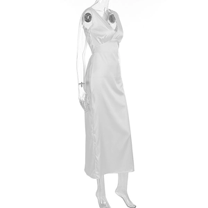 Detail of elegant white sleeveless maxi dress with deep V-neck and satin-like finish