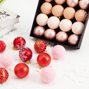 Assorted Christmas ball ornaments in red, gold and pink with various textures and patterns