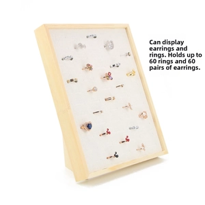 Detailed view of wood jewelry stand displaying 60 slots for rings and earrings