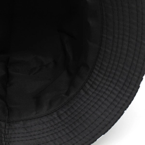 Macro shot of reinforced stitching on black polyester bucket hat brim for durability