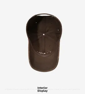Detailed interior of vintage brown baseball cap showing 6-panel structure and metal buckle