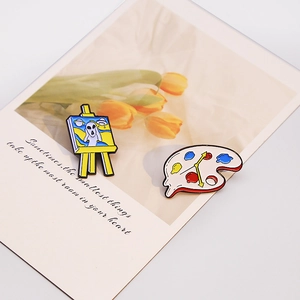 Artistic enamel pins set with alien scream painting and melting clock palette designs