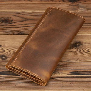 Detail of vintage brown crazy horse leather long wallet with hand-stitched seams