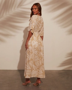 Detailed close-up of summer maxi dress with palm leaf prints and elastic high waist
