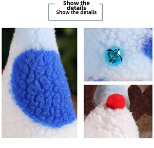 Macro detail of Christmas gnome showing blue bells, plush fabric, and festive deer antlers