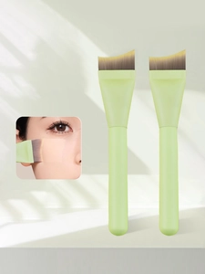 Macro detail of crescent flat foundation brush with ultra-thin synthetic gradient bristles