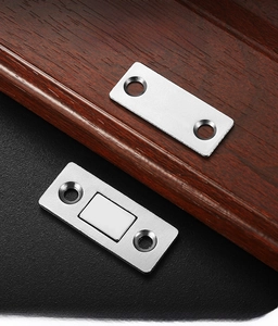 Detailed view of brushed stainless steel magnetic door catch with screw holes for sliding doors