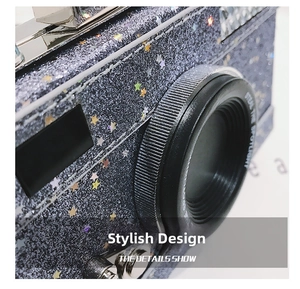 Detail of glittery navy blue camera-shaped mini bag with colorful star sequins