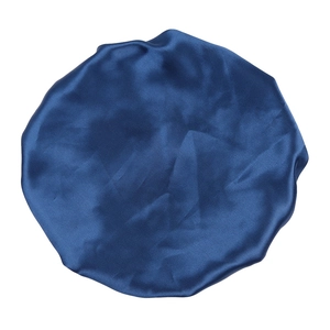 Detailed view of dark blue satin bonnet showing smooth silk texture and elastic band