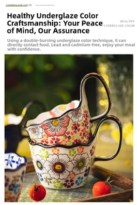 Detail view of a hand-painted floral ceramic mug with a unique curved handle and daisy pattern