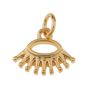 Detail of golden eye-shaped pendant with crown accents for DIY jewelry making