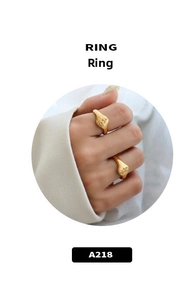 Macro shot of gold-plated rose flower relief ring with vintage French style and minimalist feel