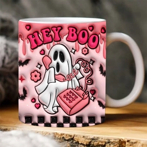 Cozy lifestyle view of a pink ceramic Halloween mug featuring a cute Spooky ghost and Hey Boo text