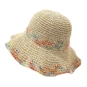 Summer woven straw sun hat with colorful stripes and wavy brim for beach vacation
