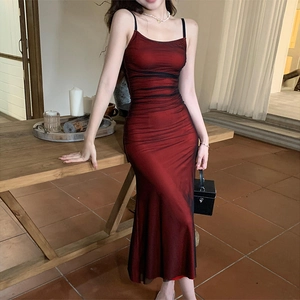 Detail view of deep red mesh midi dress with elegant pleated texture and slim fit design