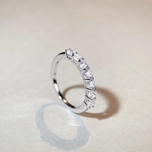 S925 sterling silver eternity band featuring seven round sparkling cubic zirconia stones