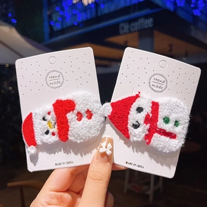 Handmade plush Christmas hair clips set with snowman and Santa Claus knitted figures