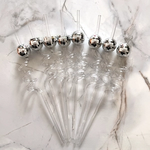 Set of eight clear spiral straws featuring silver mirrored disco ball party decorations