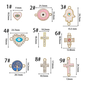Detail of 9 alloy evil eye charms including cross and heart shapes with exact dimensions