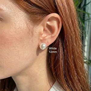 Classic 925 sterling silver stud earrings with 12mm white pearls shown on a female model