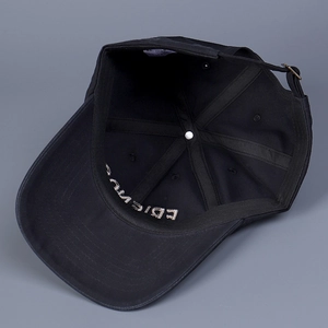 Detail of black cotton baseball cap interior featuring embroidered FRIENDS text and strap