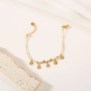 Bohemian gold stainless steel bracelet with green stone beads and radial metal pendants