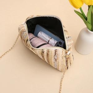 Rainbow striped woven crossbody bag with gold chain strap showing spacious interior
