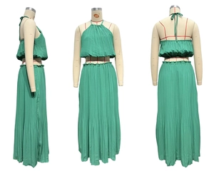 Three-way view of a grass green pleated two-piece set with halter top and high-waist skirt