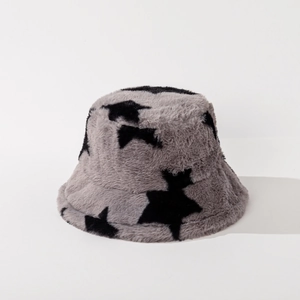 Detail of grey faux rabbit fur bucket hat with black star patterns and soft texture