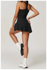 Detail of racerback top and high-waisted tennis skirt set with slimming athletic fit