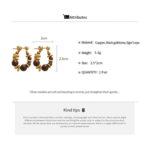 Detailed specs of Tiger's Eye beaded earrings with golden brass hardware and silver pins