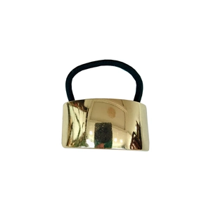 Detailed view of irregular golden metal fastener and high elasticity black hair rope