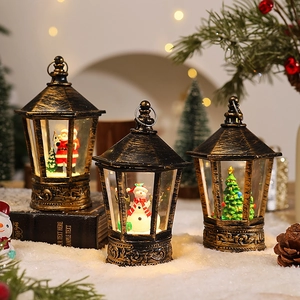 Close-up of vintage Christmas lantern set with Santa Claus and snowman inside
