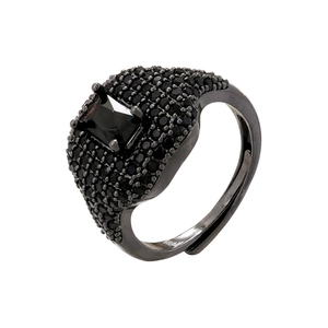 Detailed macro view of an adjustable gunmetal ring with black rectangular stone and micro-pave