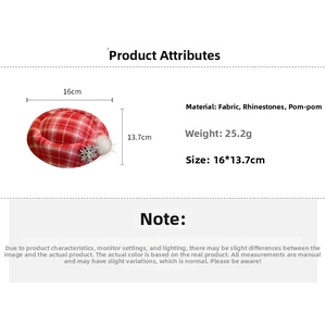 Detail of red plaid mini hat hair clip with rhinestone snowflake and white pompom decor