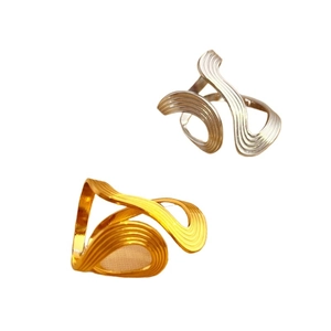 Irregular flowing curve rings in gold and silver finish with elegant linear textures