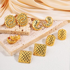 Golden 18k plated titanium steel earrings set with zircon and pearls on silk