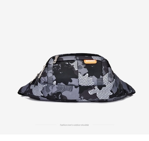 Detail view of water-resistant camo tactical waist bag with durable zippers and sports label