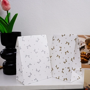 Minimalist gold and silver bow pattern paper gift bags for candy and bakery treats