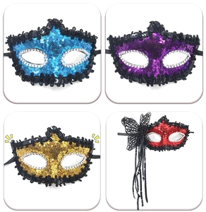 Detail of four colorful masquerade masks with sequins, lace butterflies and glitter finish