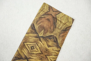 Close-up of the professional stitching and wood grain print on the long sleeve dress