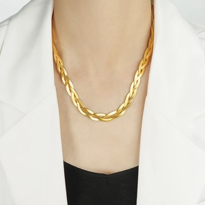 Handmade woven gold snake chain necklace in stainless steel on elegant female model