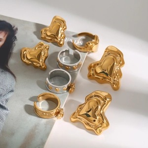 Polished stainless steel heart-shaped earrings and open bangles set in gold and silver