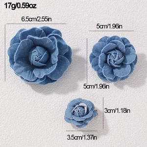 Detailed size comparison of three denim camellia brooches in different diameters