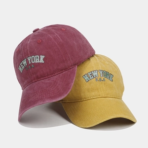 Vintage washed cotton baseball caps in burgundy and mustard with New York embroidery